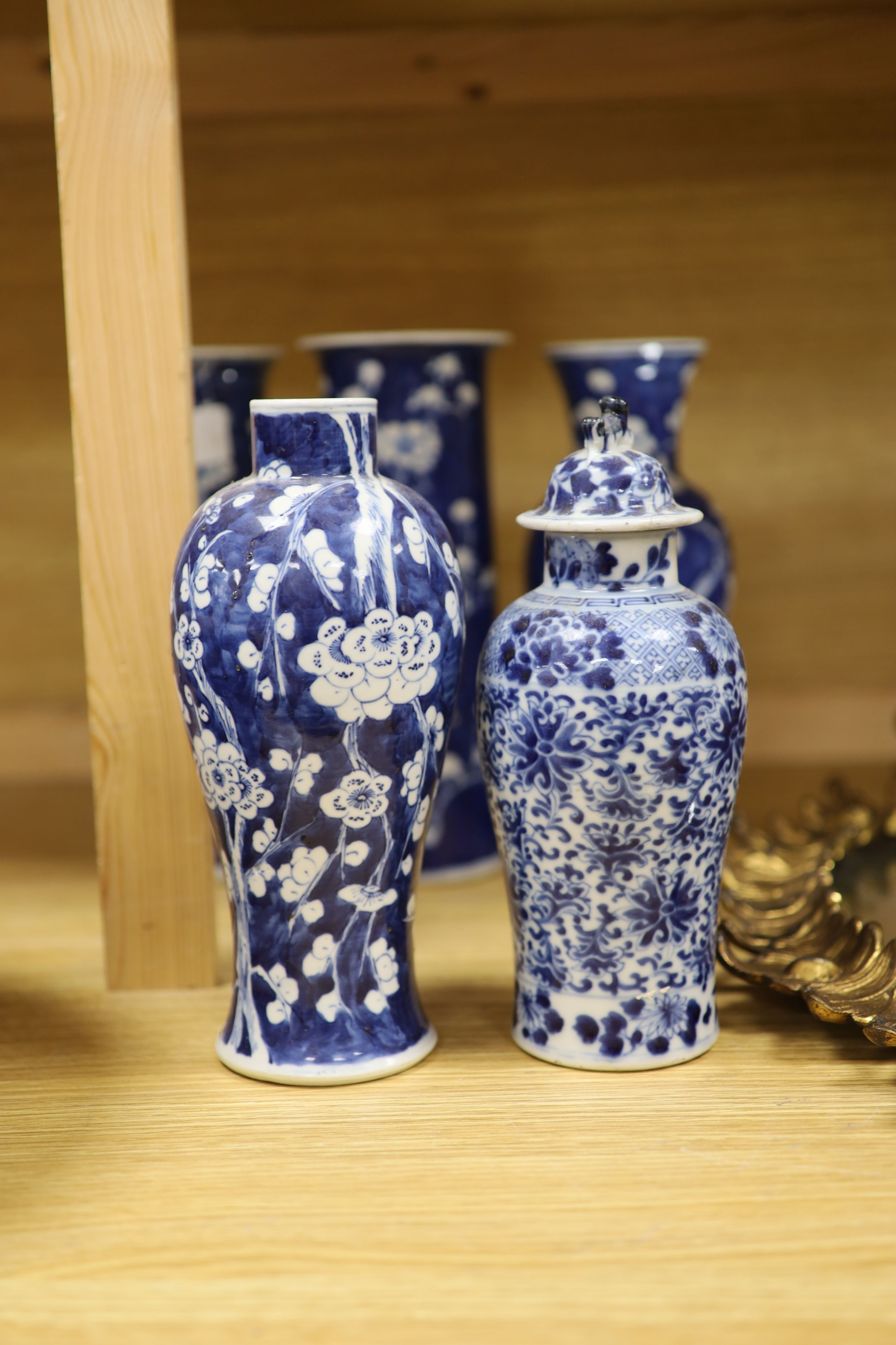 Four Chinese prunus pattern vases and a vase and cover, tallest 26.5cm